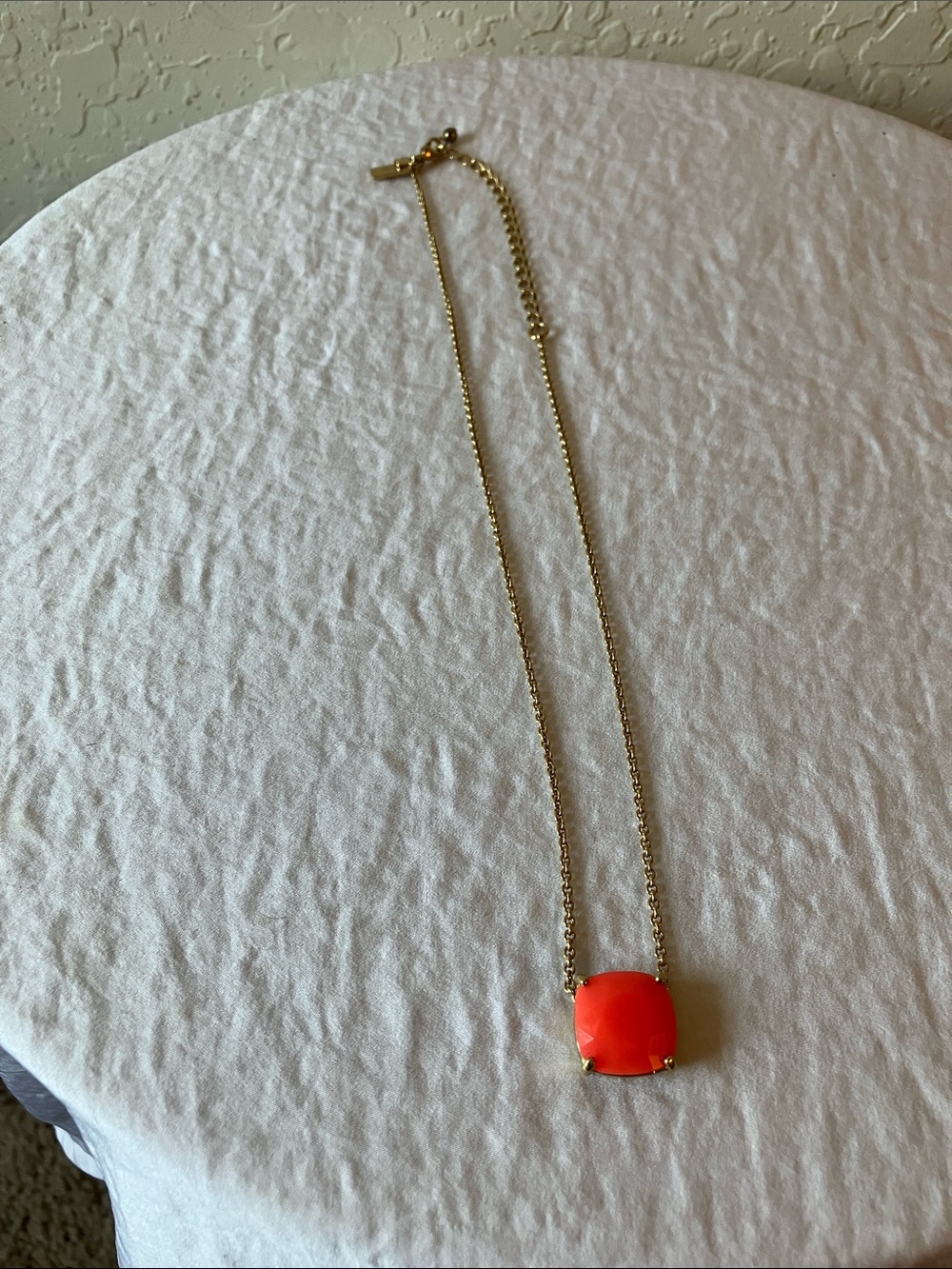 kate spade: Gold-Tone “Cause-a-Stir” Cushion Cut Coral Pendant Necklace